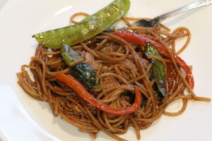 gluten free lo mein served on plate with fork
