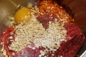 homemade barbeque meatball ingredients in mixing bowl