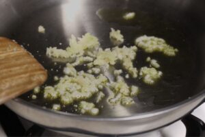 sauteing minced garlic in olive oil