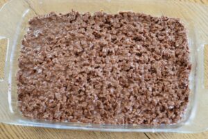dairy free brownie goodie bars in baking dish showing top layer