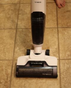 tineco cordless vacuum mop on ceramic tile floor