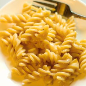 easy homemade gluten free macaroni and cheese on a plate with a fork