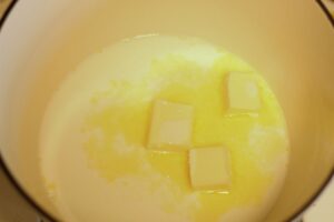 milk & butter in Dutch oven for homemade gluten free macaroni & cheese