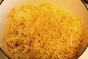 ingredients in Dutch oven for homemade gluten free mac n cheese