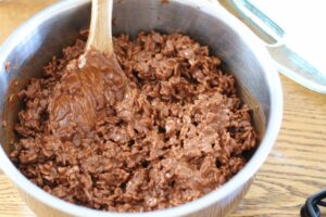 top layer of dairy free brownie goodie bars in mixing bowl with spoon