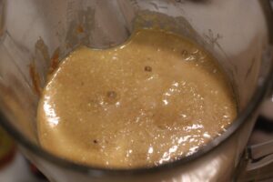 batter for dairy free & gluten free banana chocolate chip muffins in blender