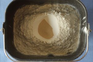 ingredients in bread machine pan for oatmeal bread dough