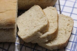 oatmeal bread sliced on cooling rack
