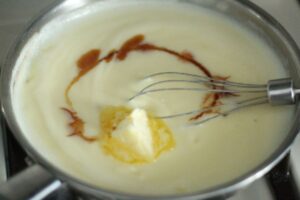 butter and vanilla added into cream filling in saucepan