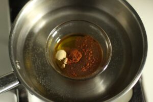 ground cayenne pepper and ginger added to melted mixture for homemade muscle rub