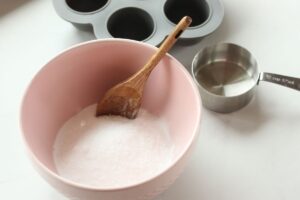 dry ingredients for natural toilet cleaning bombs in a bowl