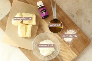 ingredients for homemade whipped body butter laid on a cutting board