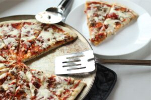 homemade pizza served on plate made with homemade pizza dough recipe