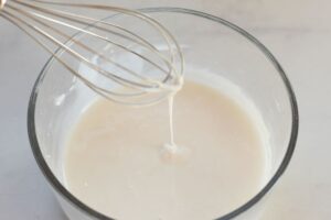 powdered sugar and milk whisked together for iced oatmeal cookies