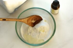 ingredients for diy baking soda scrub in a glass bowl