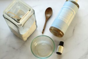 Ingredients and glass bowl for diy baking soda scrub