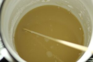 ingredients for natural deodorant mixed together in a double boiler