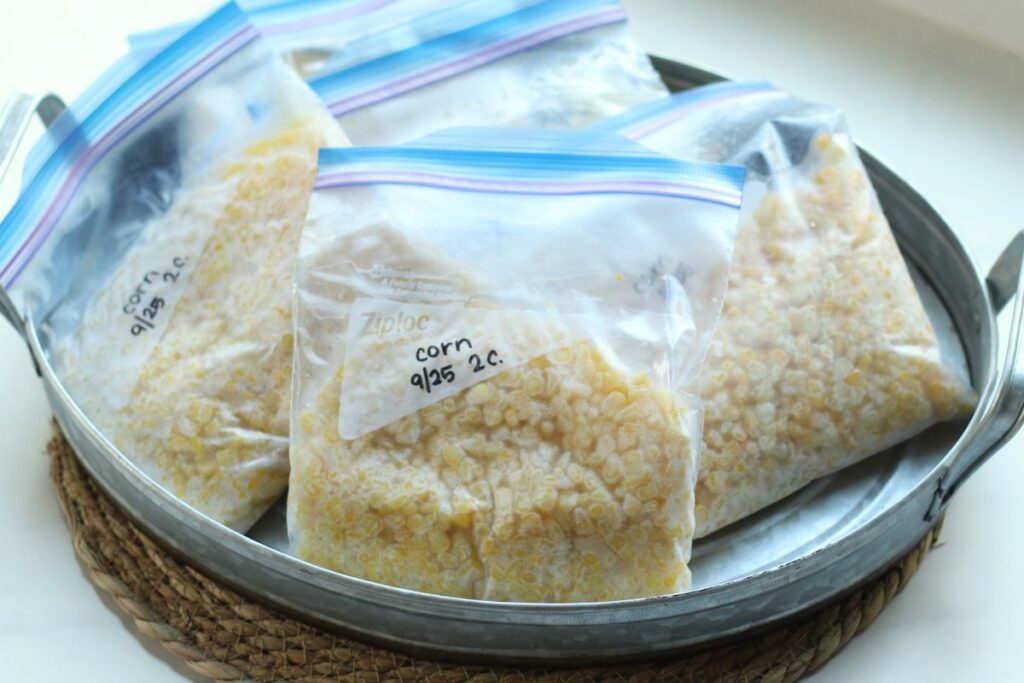 frozen bags of sweet corn in a tray