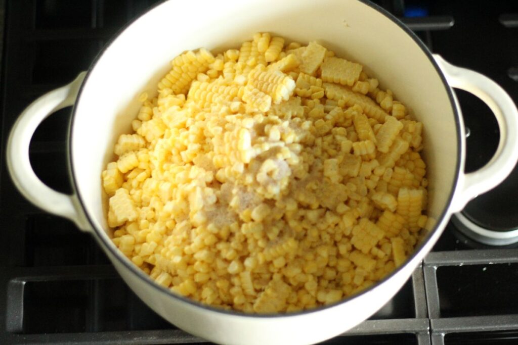 fresh cut sweet corn in large pot with water and salt