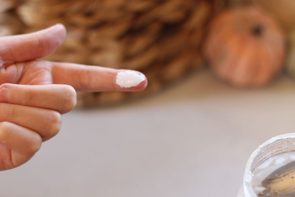 small amount of coconut oil on fingertip