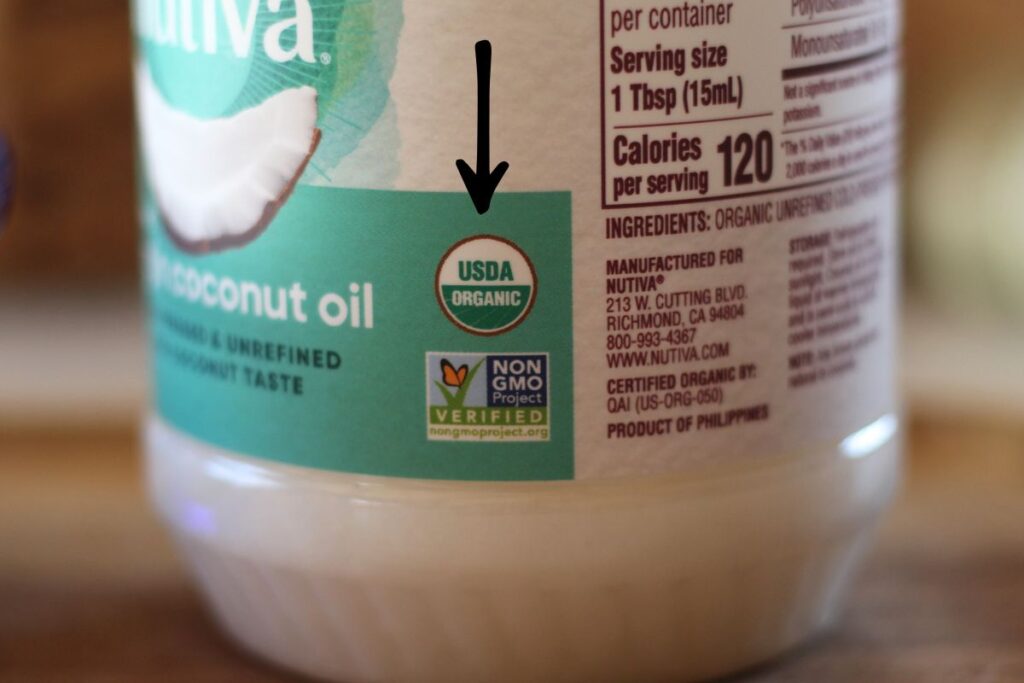label showing organic label & non-GMO label of coconut oil jar