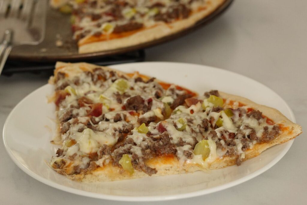 homemade cheeseburger pizza slices on a plate