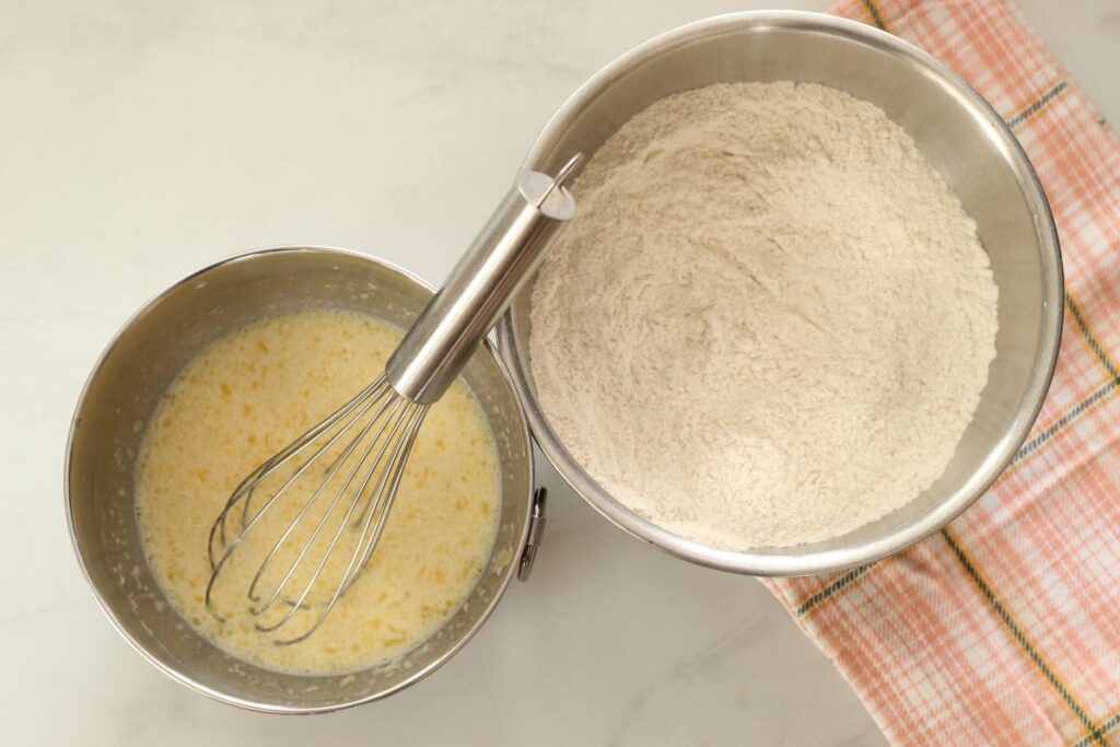 bowl of wet ingredients next to bowl of dry ingredients