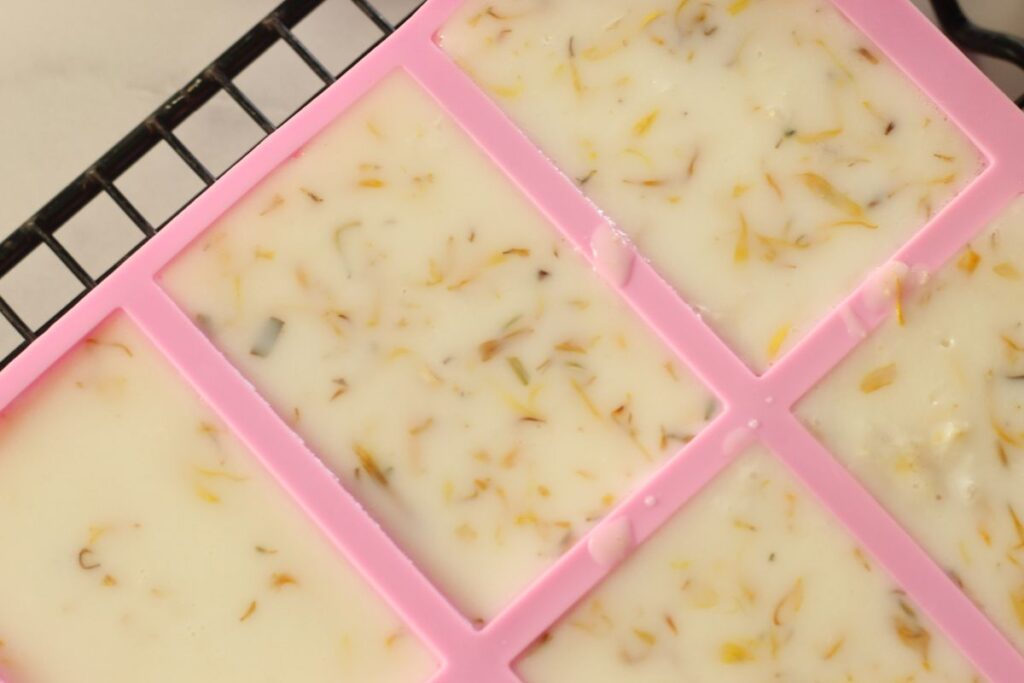 garden hands soap in silicone molds that has been sprayed by isopropyl alcohol and air bubbles removed