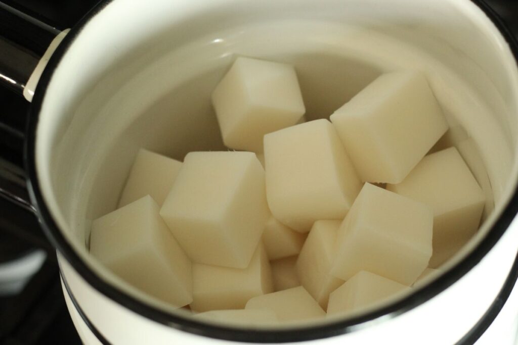 cubes of soap base in double boiler