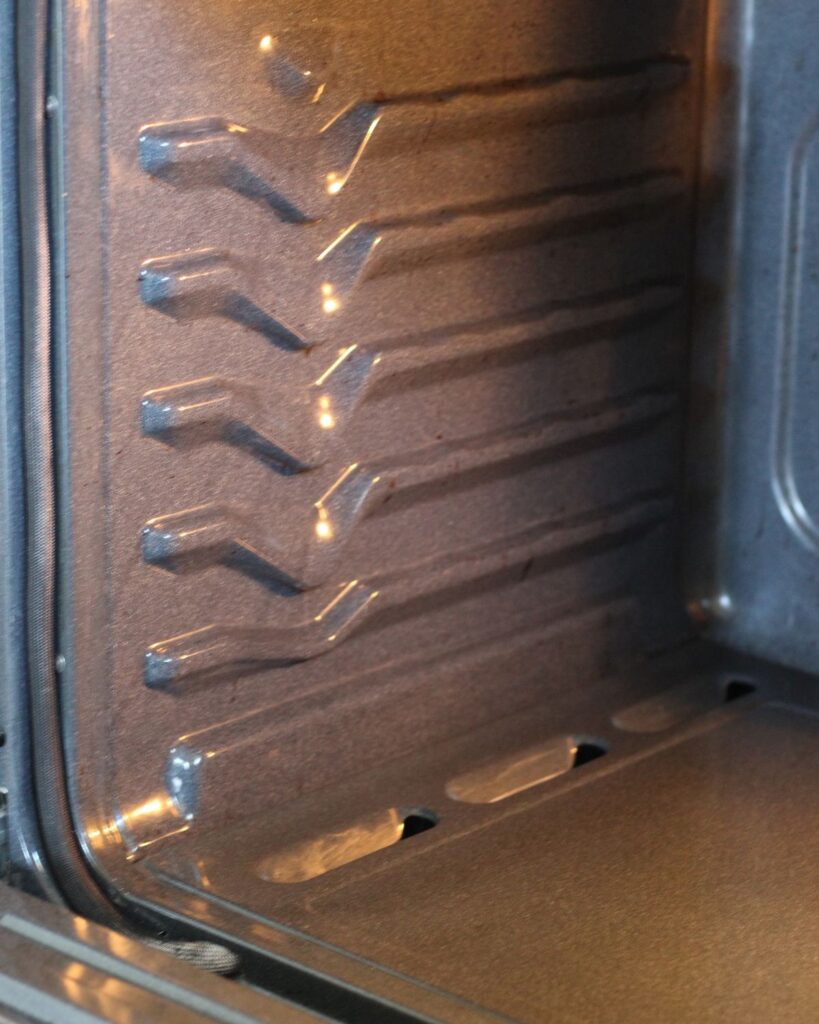 clean oven side wall and partial bottom oven floor