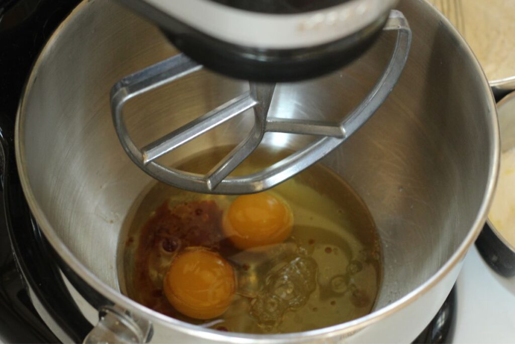 wet ingredients for lemon crinkle cookies in stand mixer with paddle attachment