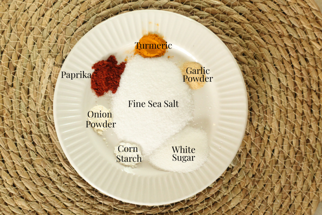 ingredients for homemade lawry's seasoned salt on a plate and labeled