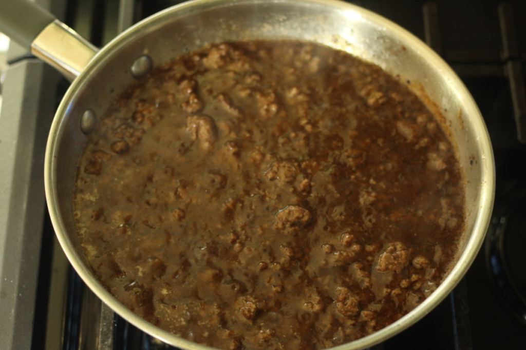 skillet of finished ground beef and sauce of beef & broccoli stir fry